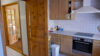 Ebenerdiger Bungalow - tolles Holzhaus mit guten energetischen Eigenschaften - Küche Richtung Flur