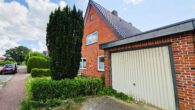 Garage rechts - Zweifamilienhaus am Kanal
